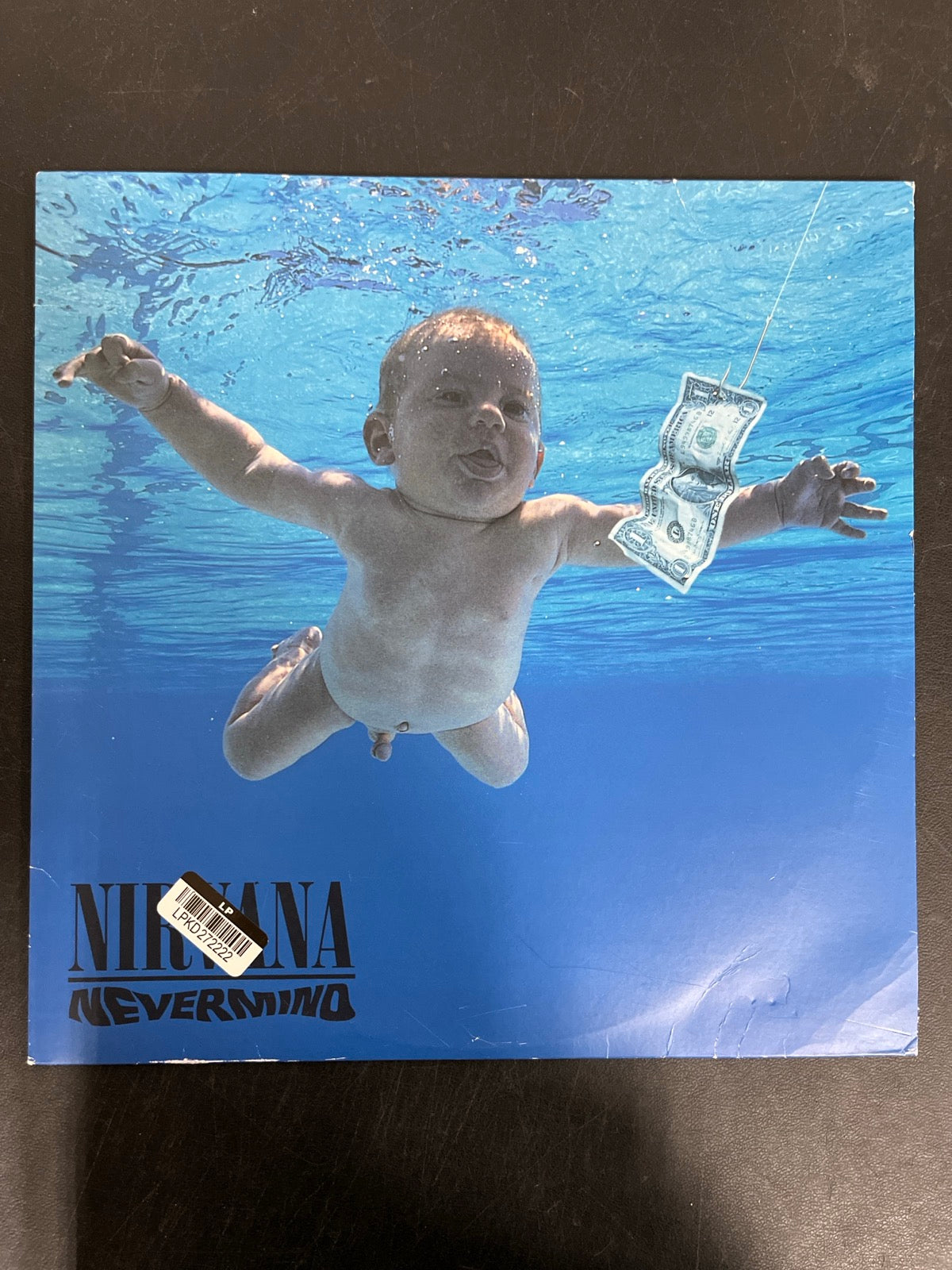 FRONT - Nirvana - Nevermind LE 180gm Metallic Silver Vinyl USED NOT TESTED